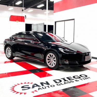Black tesla with tinted windows at SD Auto Glass & Tint